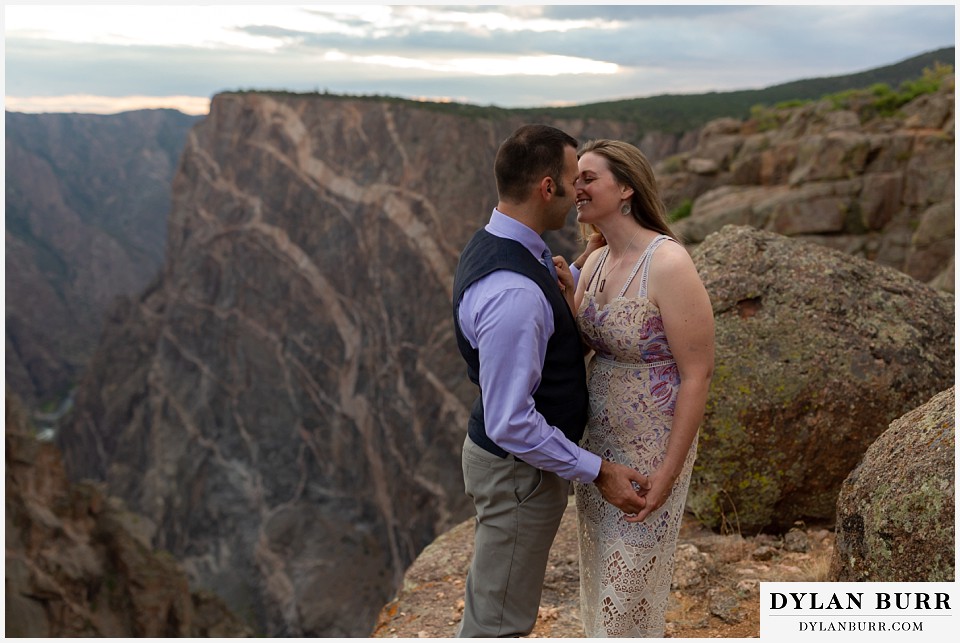 black canyon colorado elopement wedding adventure bride and groom kiss near the painted wall