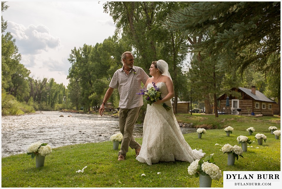 buford lodge wedding buford colorado meeker bride and father walking near river into ceremony
