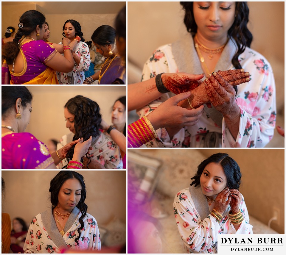 cielo at castle pines wedding colorado mountain wedding bride with henna on hands putting jewelry on