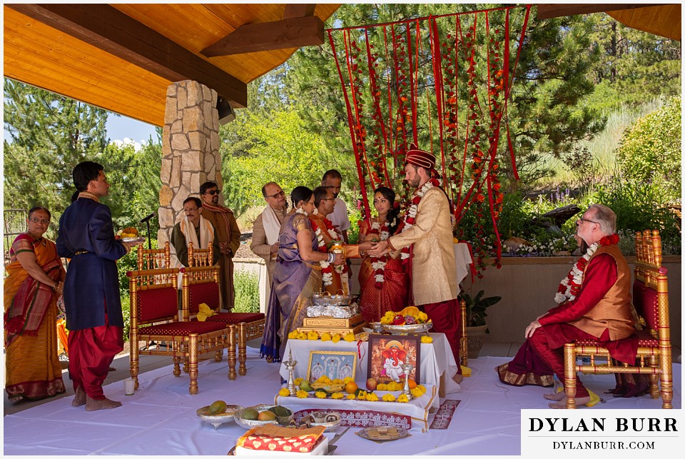 cielo at castle pines wedding colorado mountain wedding groom and brides family together hindu ceremony