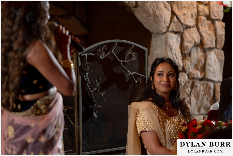 cielo at castle pines wedding colorado mountain wedding hindu bride looking on at maid of honor toast during reception