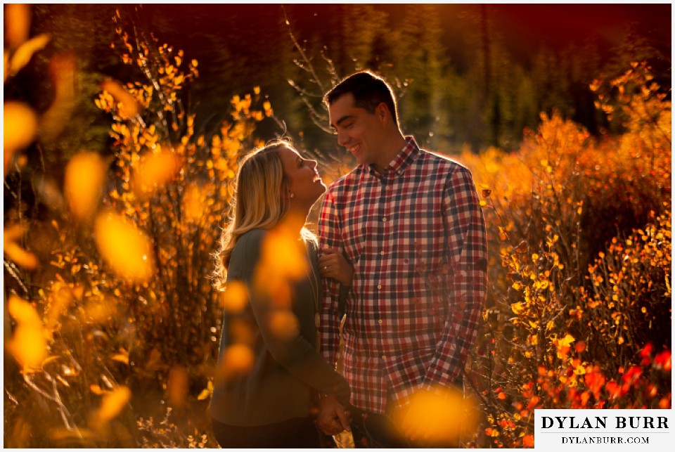 colorado mountain engagement session couple together in fall leaves