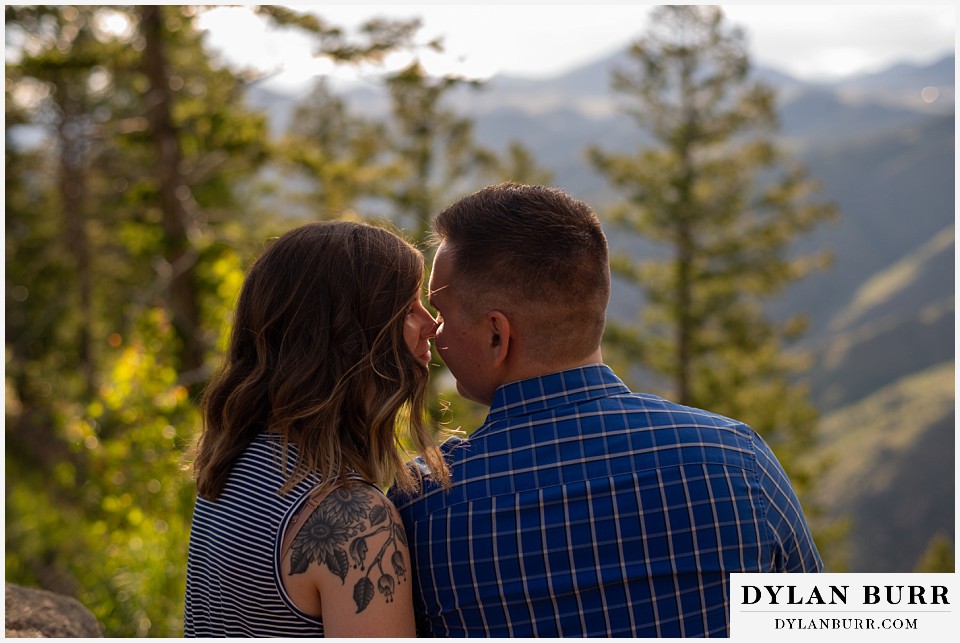 golden colorado mountain enagagement photo session couple going in for a kiss