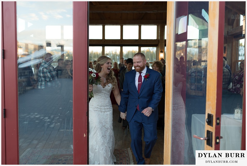 devils thumb ranch wedding in winter ceremony timber house happy