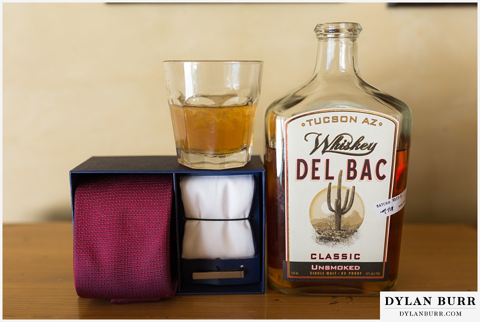 devils thumb ranch wedding in winter grooms details whiskey