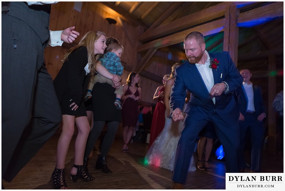 devils thumb ranch wedding in winter reception party funny groom