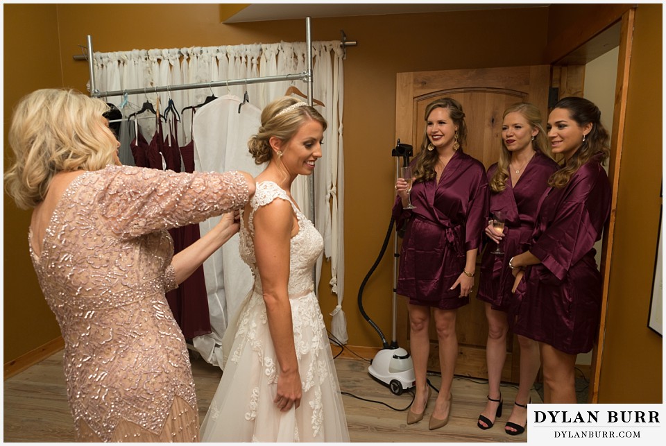 the lodge at sunspot wedding winter park bride in wedding dress getting ready