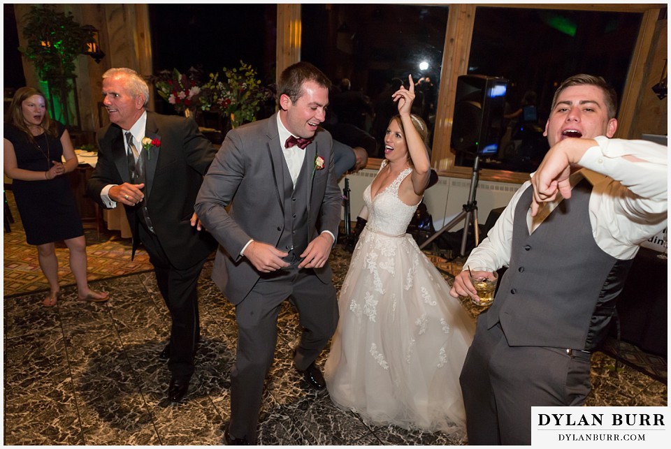 the lodge at sunspot wedding fall mountain wedding winter park reception party bride dancing with brothers
