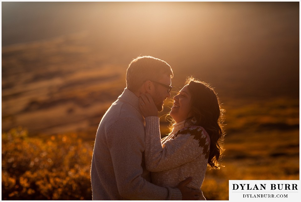 georgetown colorado engagement session couple in orange glowy sunset