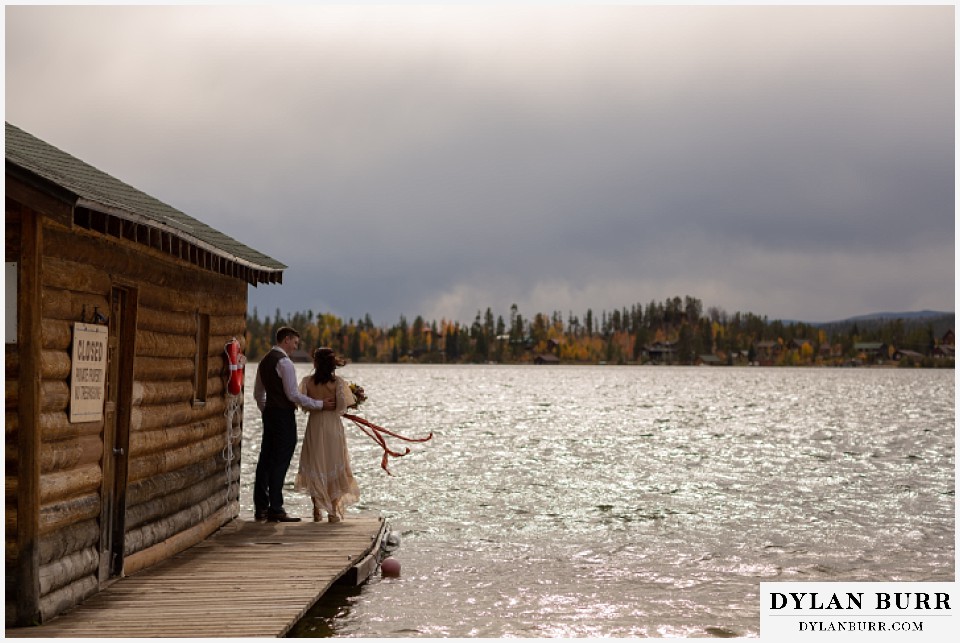 grand lake wedding elopement bride and groom on boat house