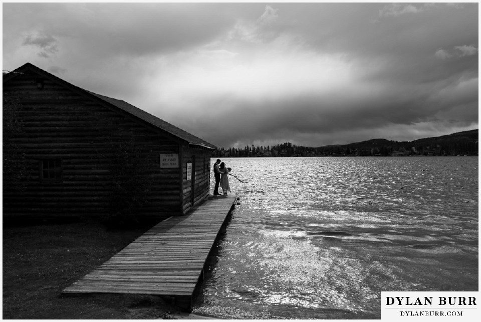 grand lake wedding elopement bride and groom at boat house black and white
