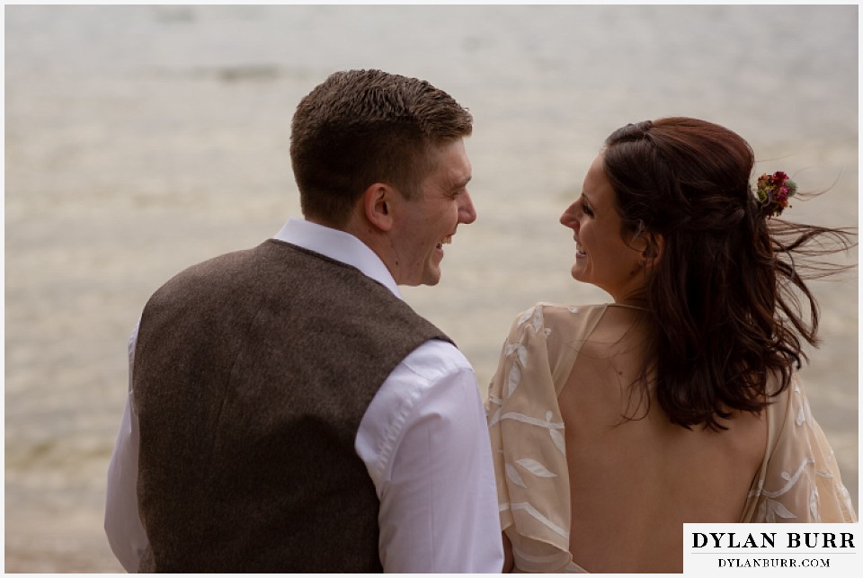 grand lake wedding elopement bride and groom laughing together