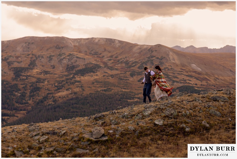 rocky mountain national park grand lake wedding elopement bride and groom walking down mountain side