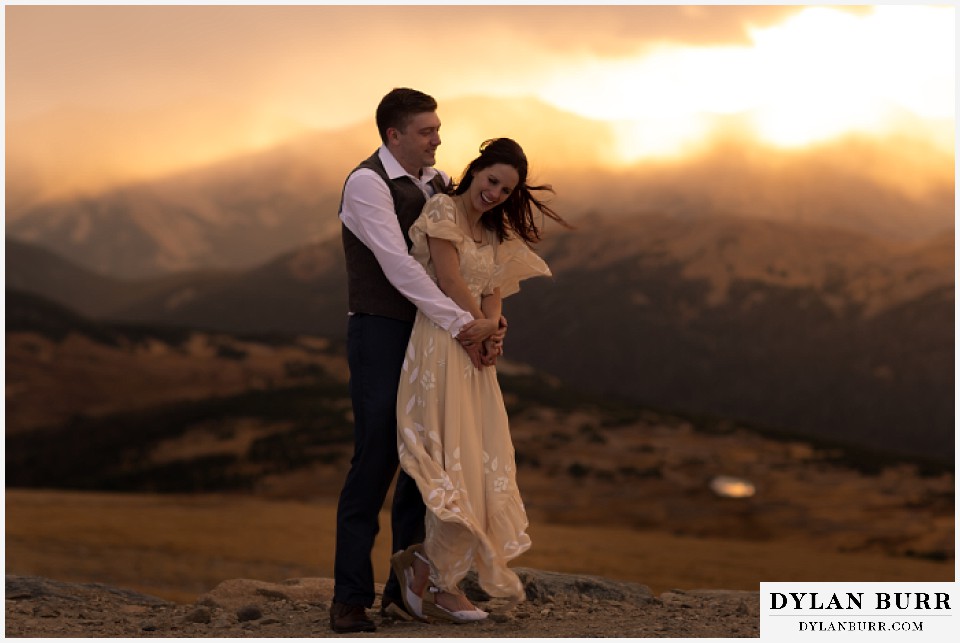 rocky mountain national park grand lake wedding elopement bride and groom laughing at sunset