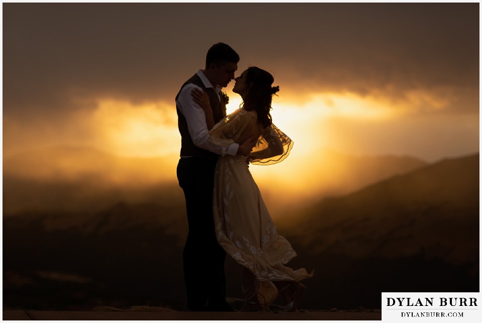rocky mountain national park grand lake wedding elopement bride and groom kissing at sunset