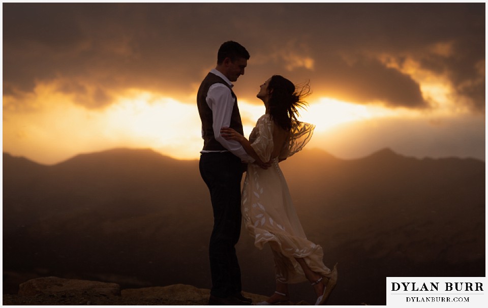 rocky mountain national park grand lake wedding elopement bride and groom in the wind at sunset