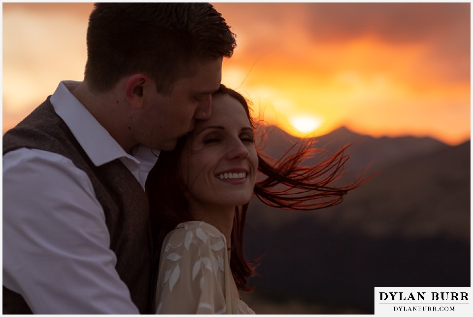 rocky mountain national park grand lake wedding elopement groom kissing brides cheek at sunset