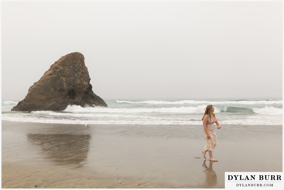 santa cruz california elopement wedding adventure bride walking on the beach by sharkfin rock