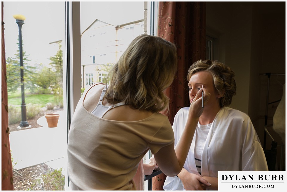 air force academy wedding bride getting makeup put on