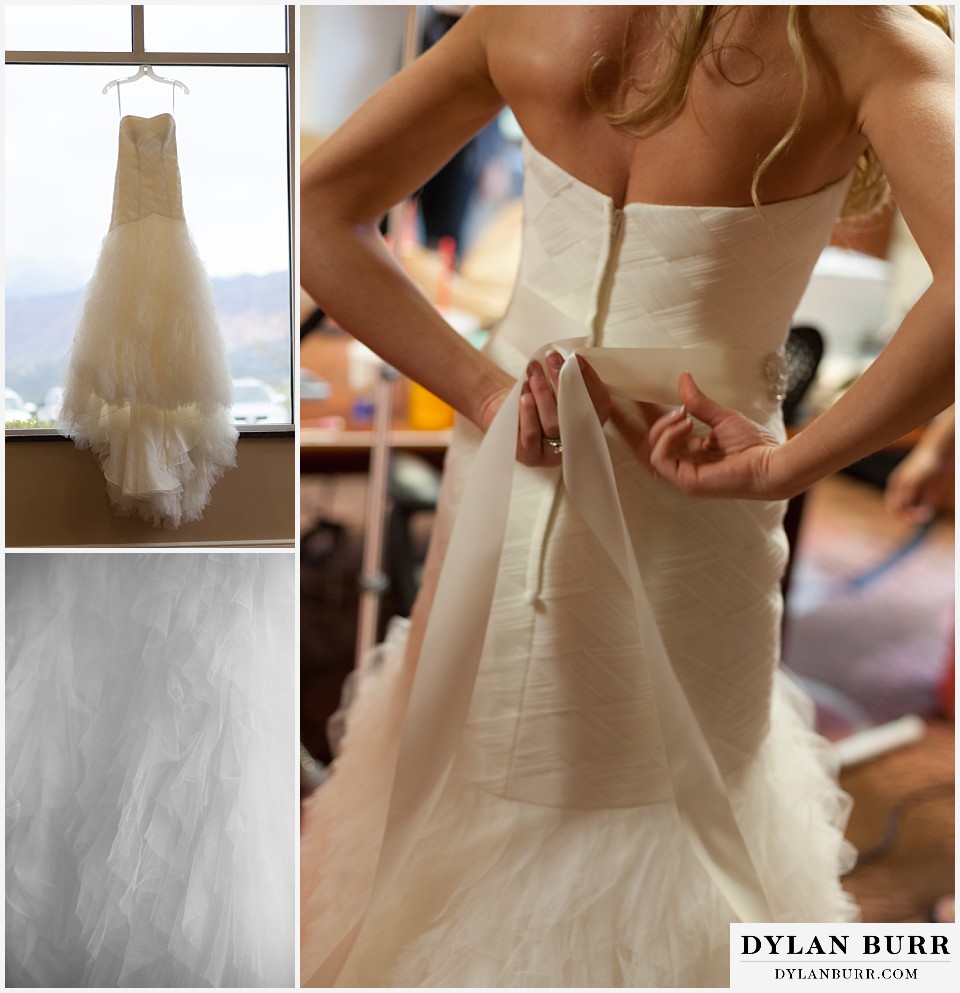 air force academy wedding bride putting on dress