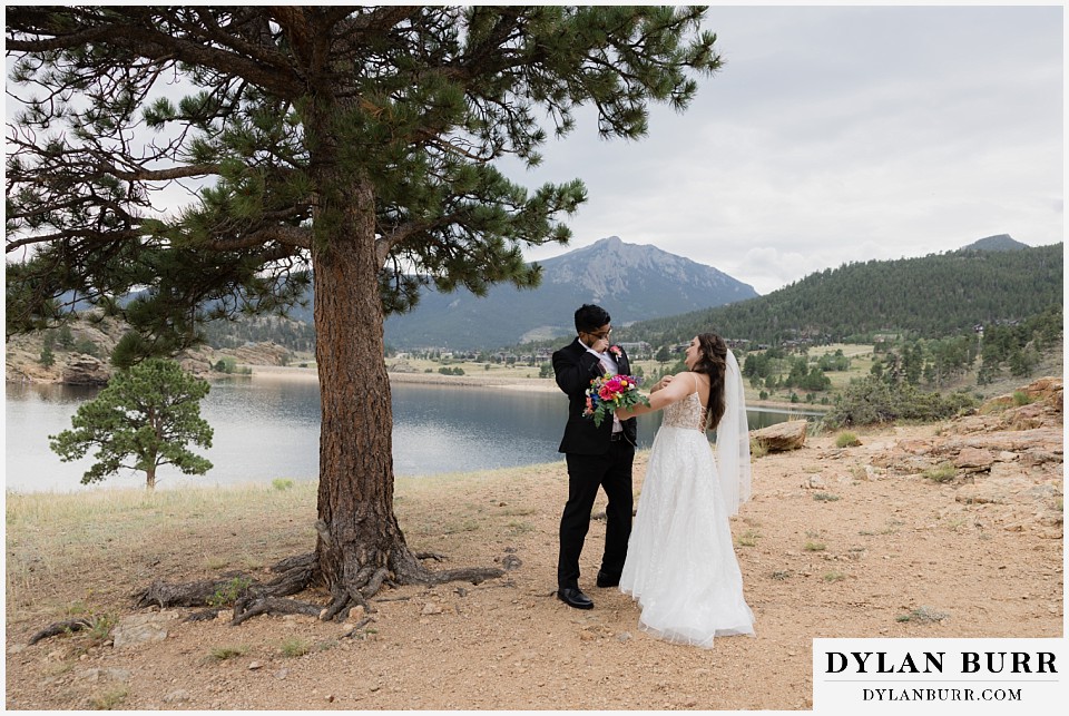 all day elopement in Rocky Mountain National Park bride showing off dress