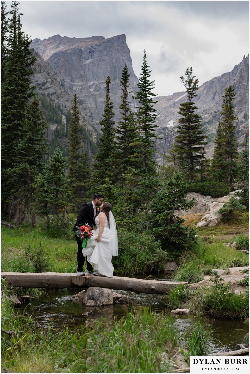 all day elopement in Rocky Mountain National Park walking across natural bridge at dream lake