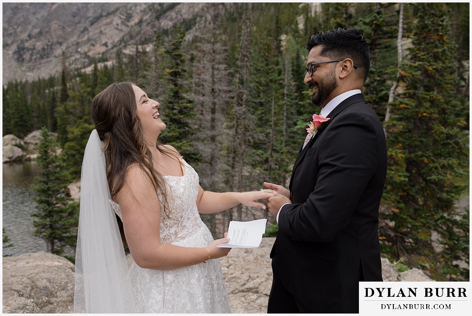 all day elopement in Rocky Mountain National Park bride reading vows to husband