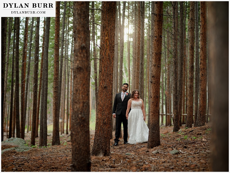 all day elopement in Rocky Mountain National Park couple standing together in the pine trees and sunlight