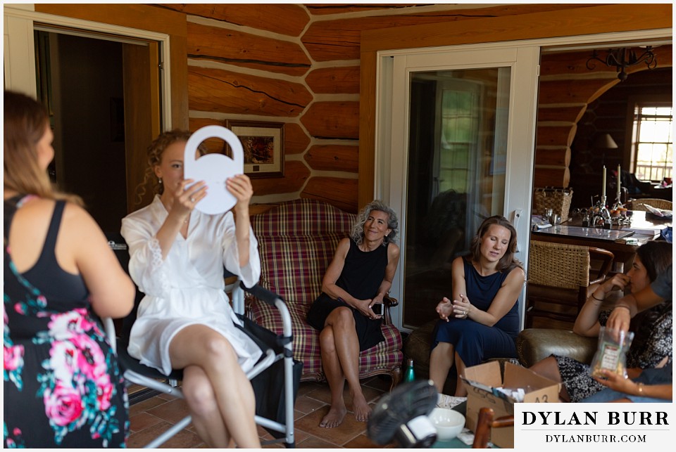bride getting ready at Antler Basin Ranch as her mother watches lovingly