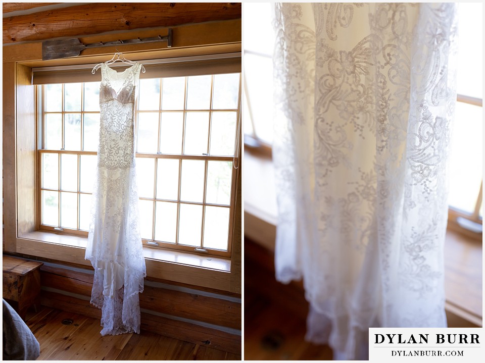 brides dress hangs in the window of the cabin at antler basin ranch