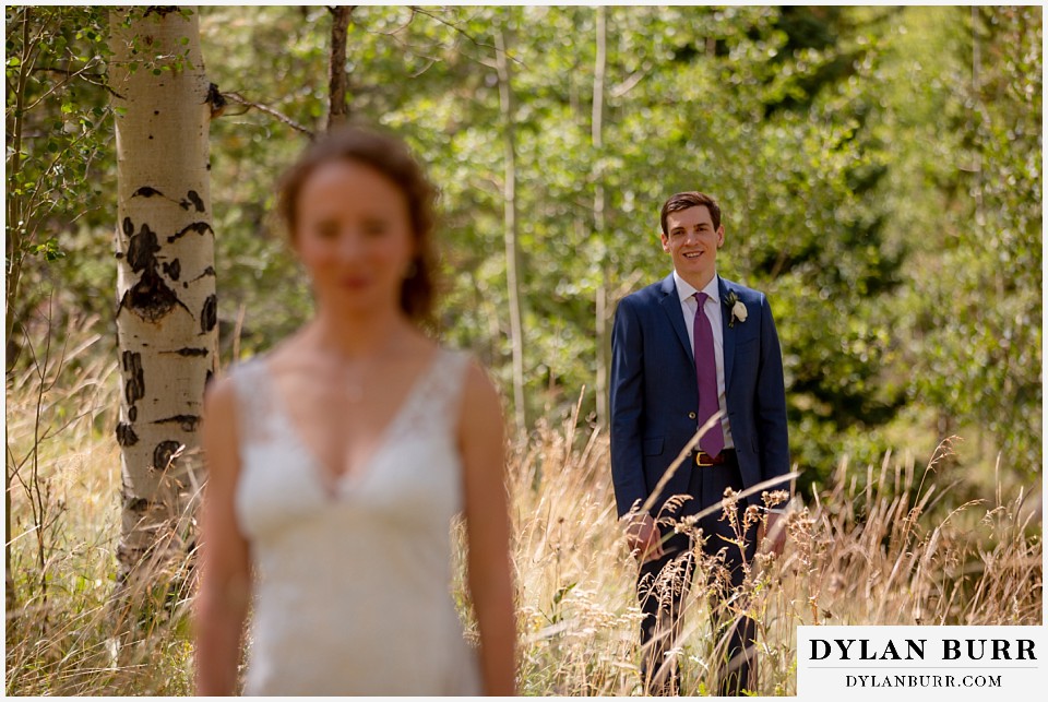 antler basin ranch wedding groom looking toward bride