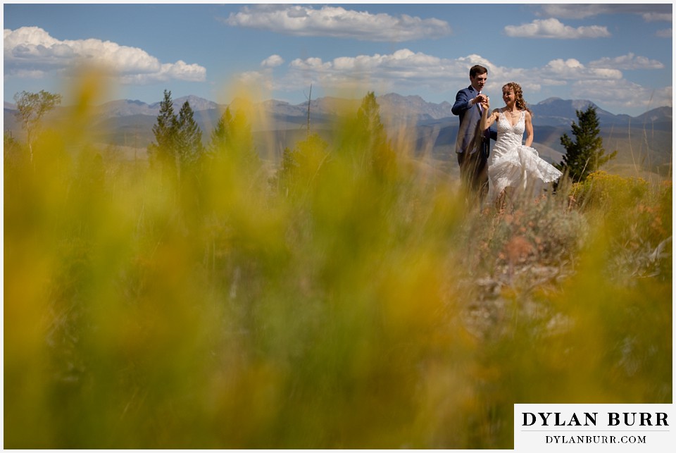 antler basin ranch wedding bride and groom dancing on mountain ridge