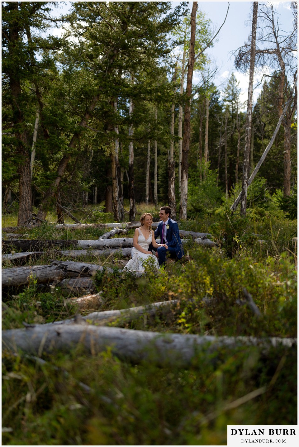 bride and groom in sunlight in the middle of the trees at antler basin ranch