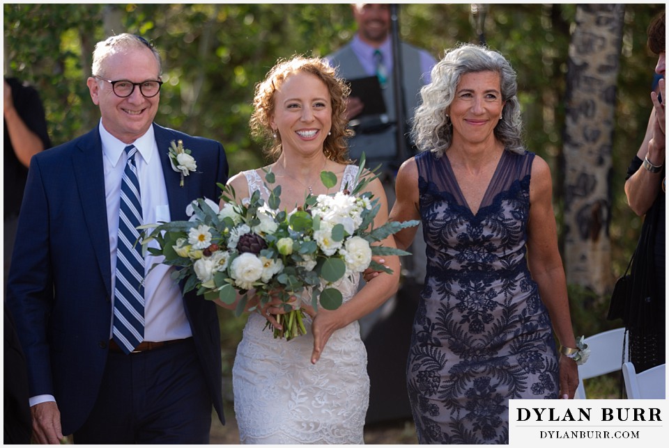 extremely happy bride entering ceremony Antler Basin Ranch wedding