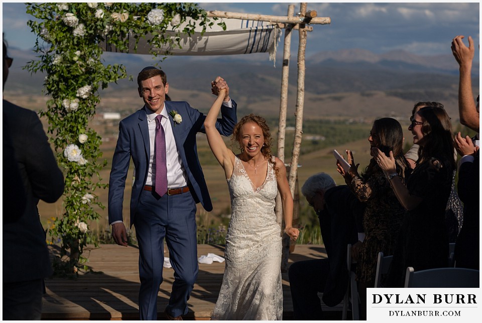 bride and groom leaving wedding ceremony Antler Basin Ranch