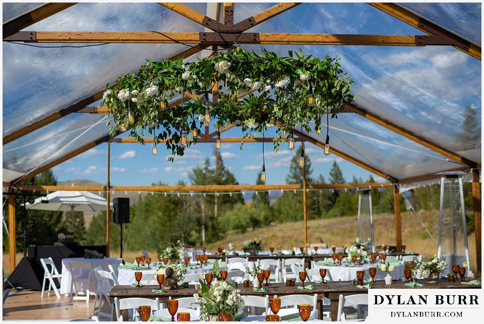 hanging floral and edison bulb chandelier