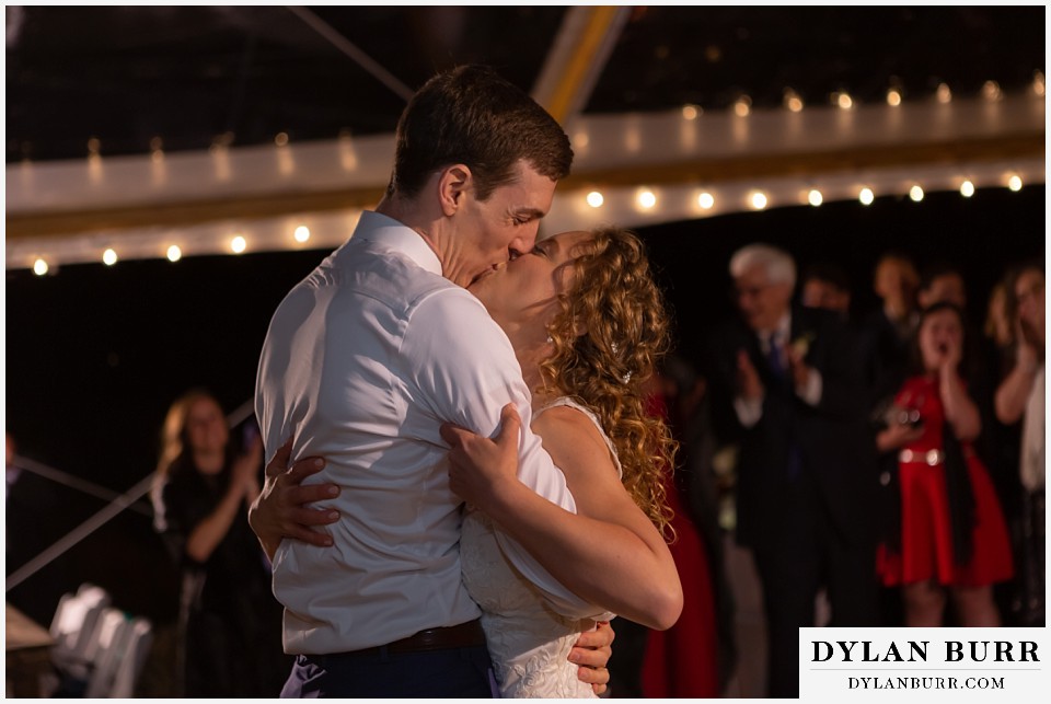 bride and groom kissing antler basin ranch wedding