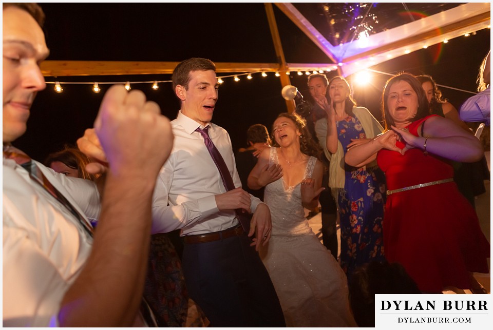 groom and bride dancing during reception antler basin ranch wedding