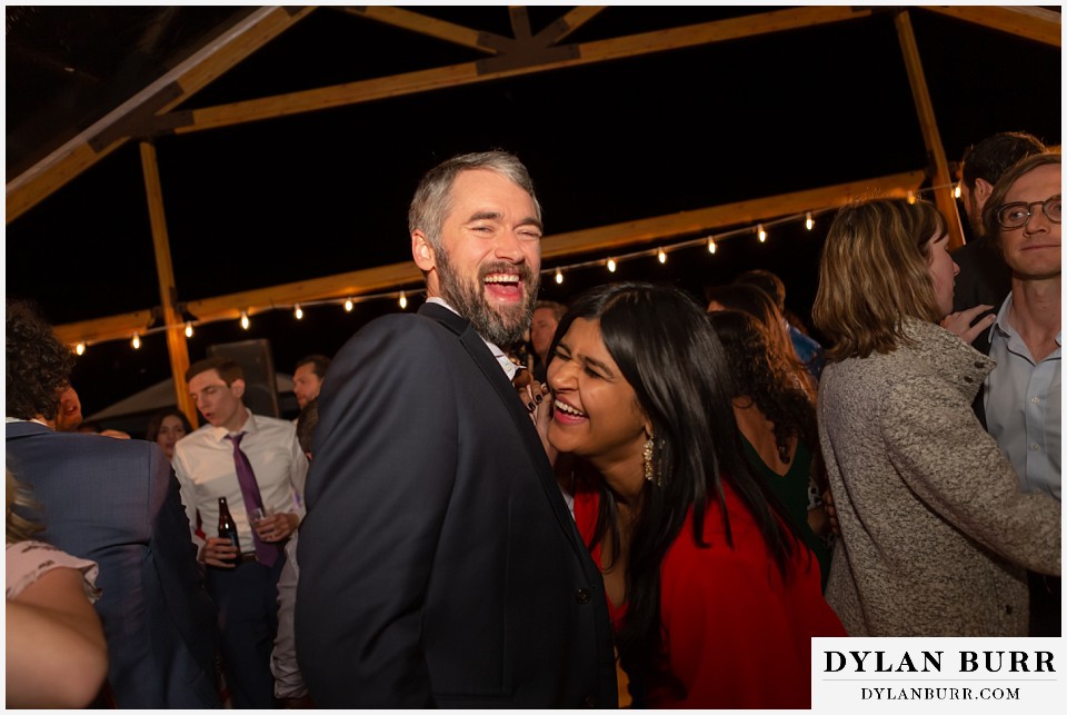 laughing together during reception antler basin ranch wedding