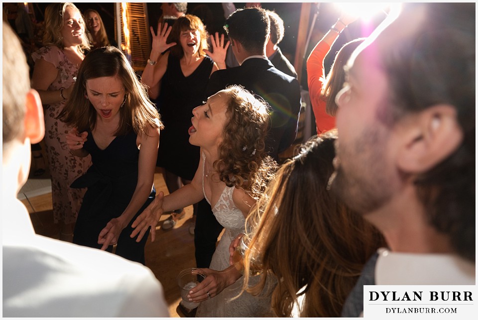 bride getting down during reception antler basin ranch wedding