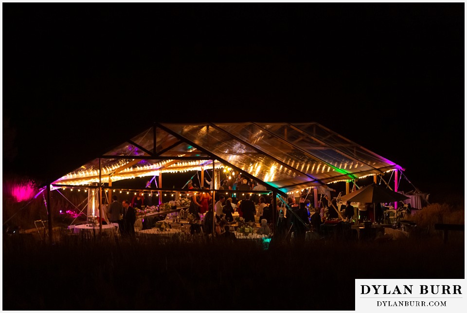 colored lights on clear wedding tent antler basin ranch wedding