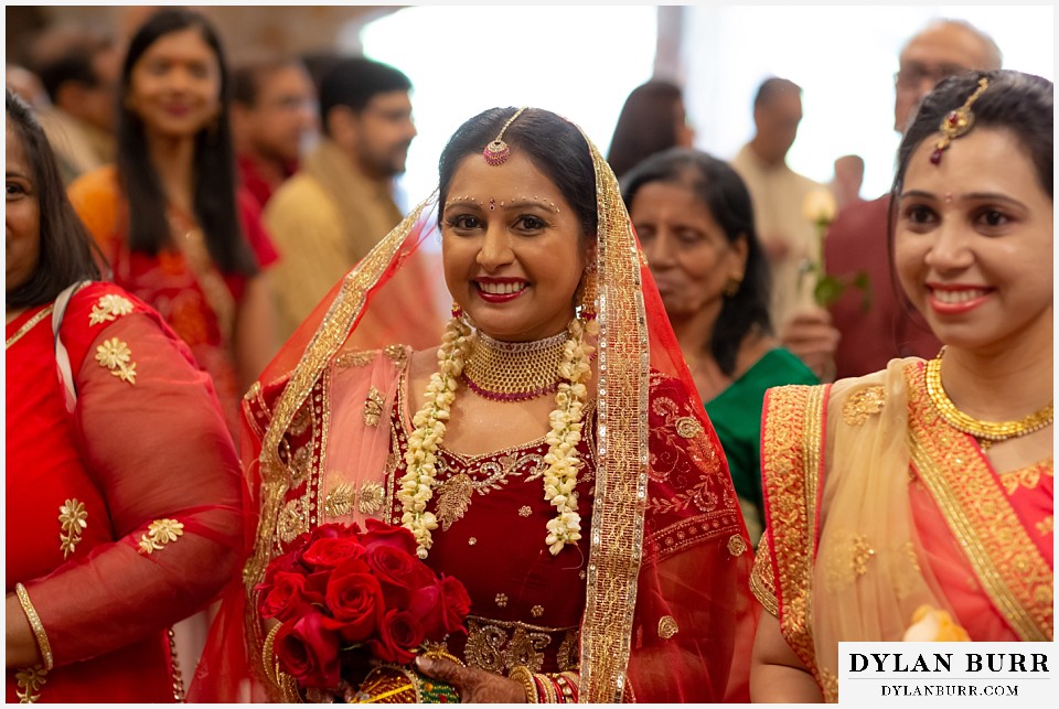 baldoria on the water wedding lakewood colorado hindu wedding bride walking down aisle