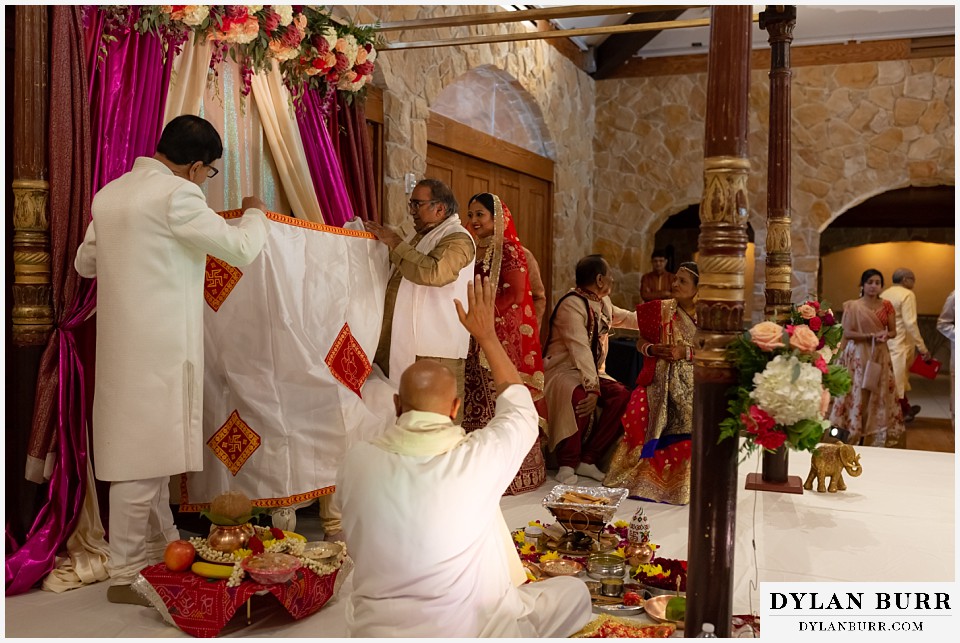 baldoria on the water wedding lakewood colorado hindu wedding bride enters ceremony groom cannot see her