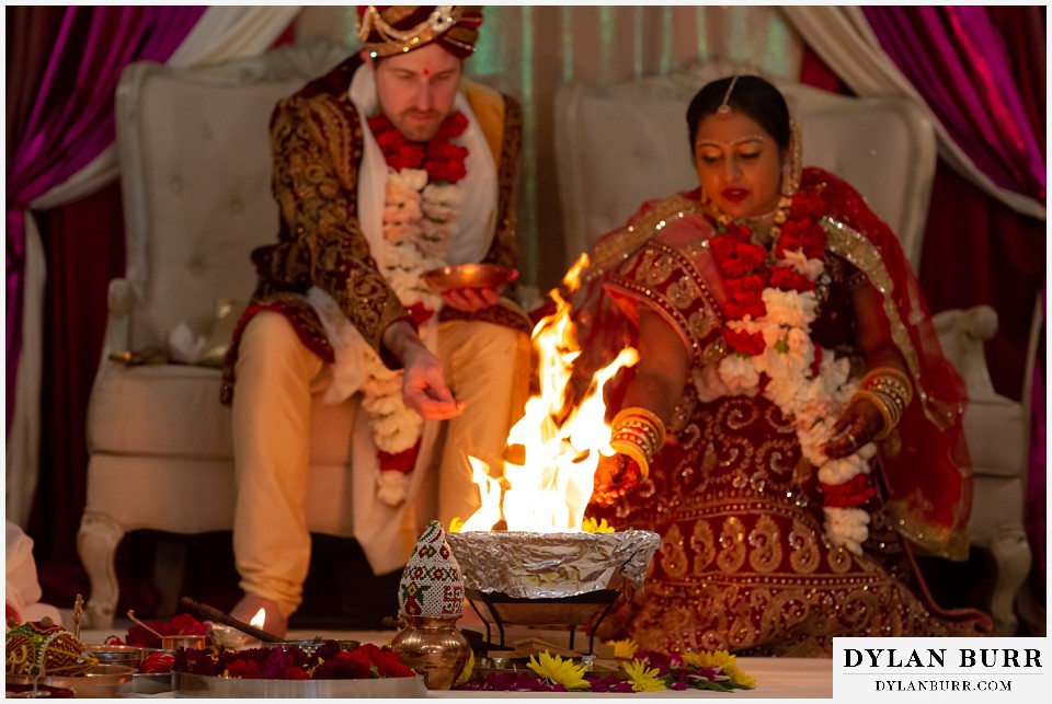 baldoria on the water wedding lakewood colorado hindu wedding bride and groom give offerings