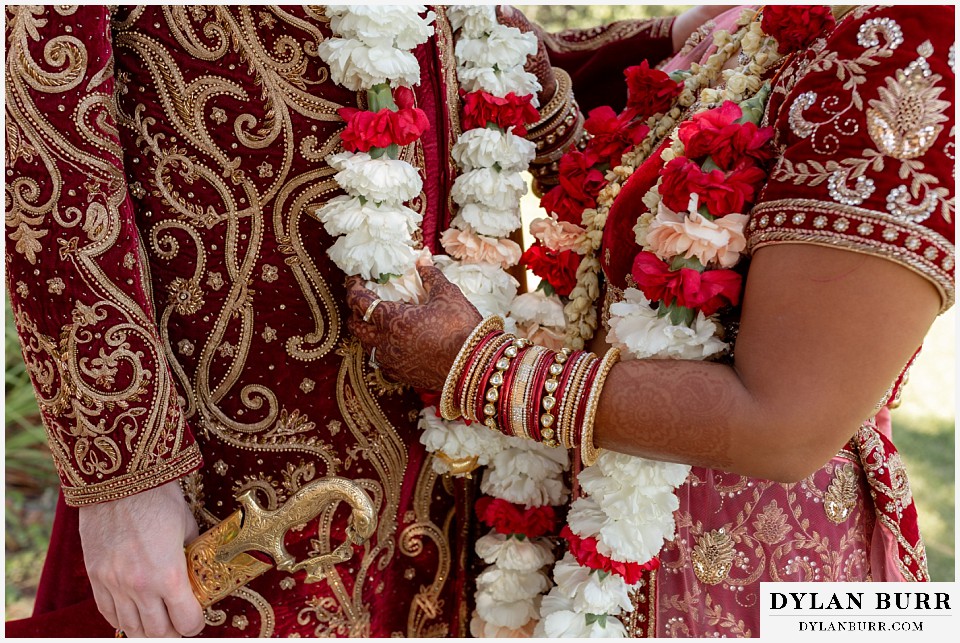 baldoria on the water wedding lakewood colorado hindu wedding close up of henna bangles and flower wedding details
