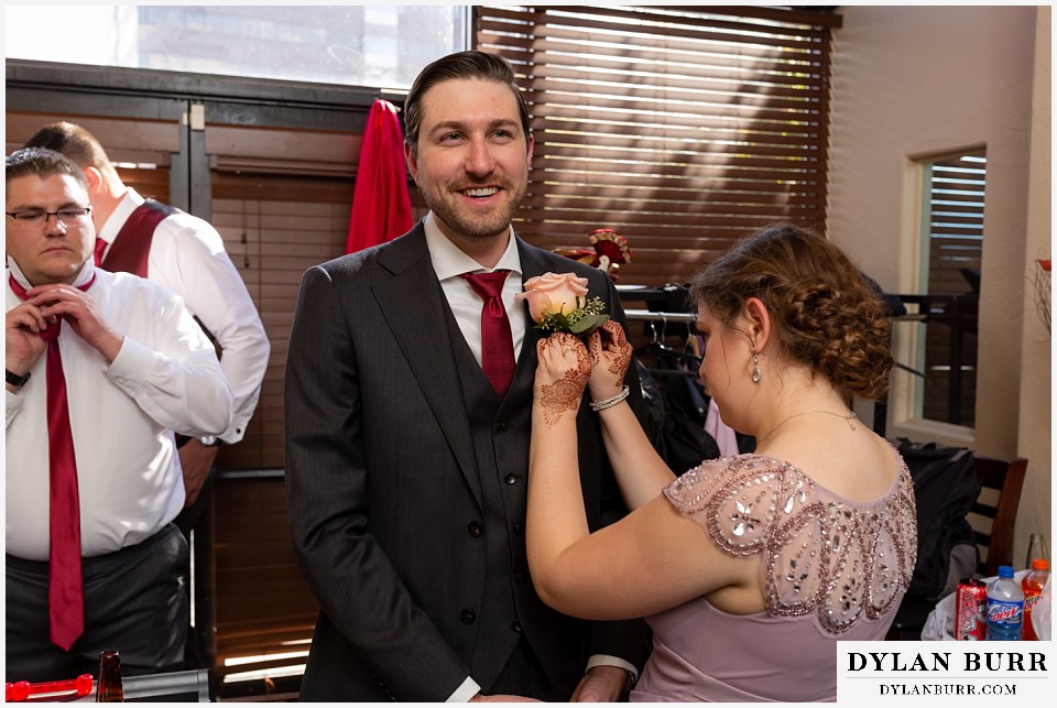 baldoria on the water wedding lakewood colorado hindu wedding groom getting ready boutineer