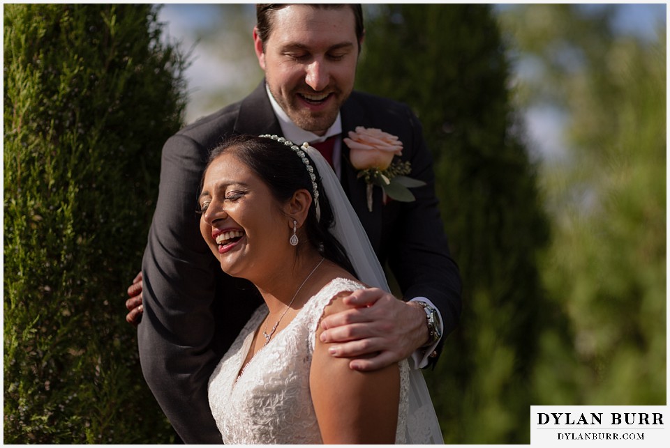 baldoria on the water wedding lakewood colorado hindu wedding bride and groom laughing together