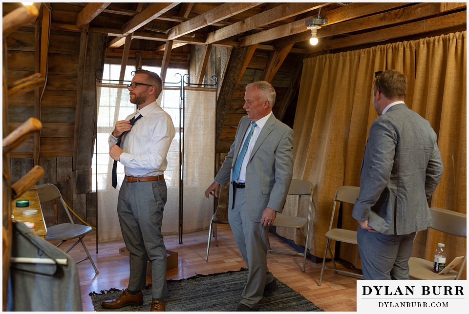 the barn at evergreen memorial park wedding groom getting ready