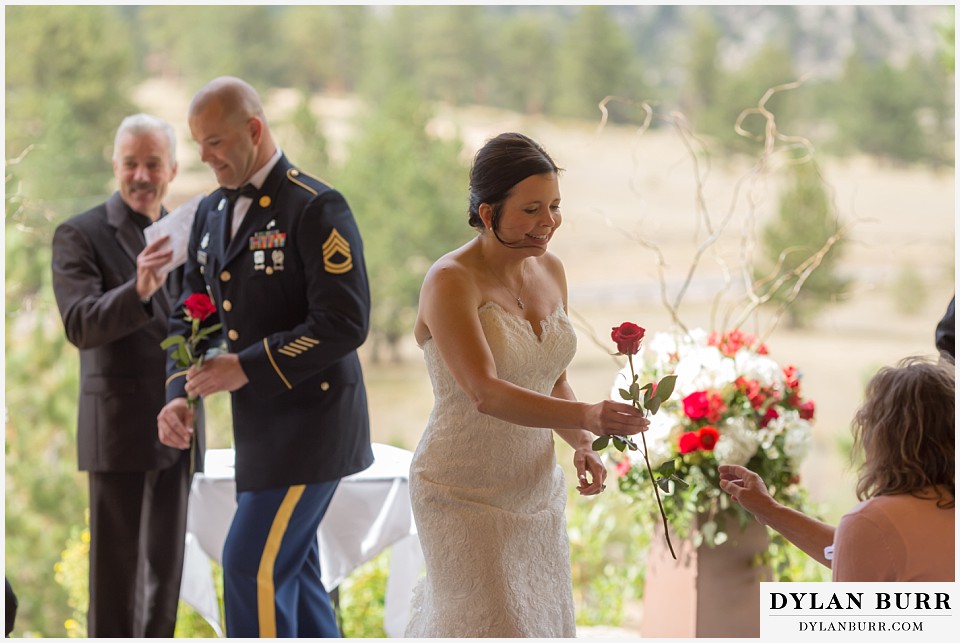 black canyon inn wedding estes park colorado offering roses to parents