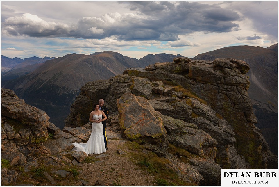  rocky mountain national park wedding bride and groom in rocks on the top of the mountains 